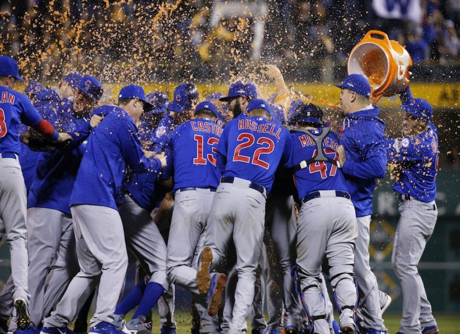 The Chicago Cubs douse each other after defeating the Pittsburgh Pirates in the National League wild card baseball game, 4-0, Wednesday, Oct. 7, 2015, in Pittsburgh. They advance to play the St. Louis Cardinals in the National League division series. (AP Photo/Gene J. Puskar)