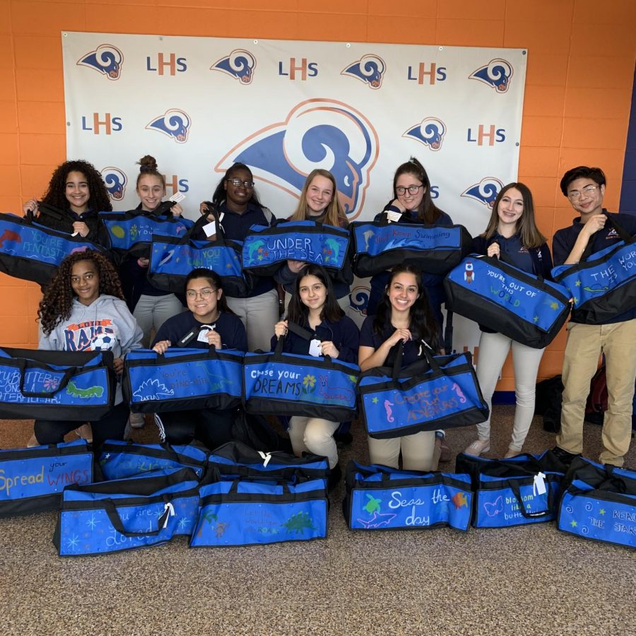 Junior Student Council Members posing with sweet cases