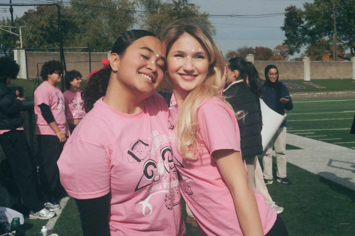 Juniors, Lexi and Bri, pose for a pre-game picture. 