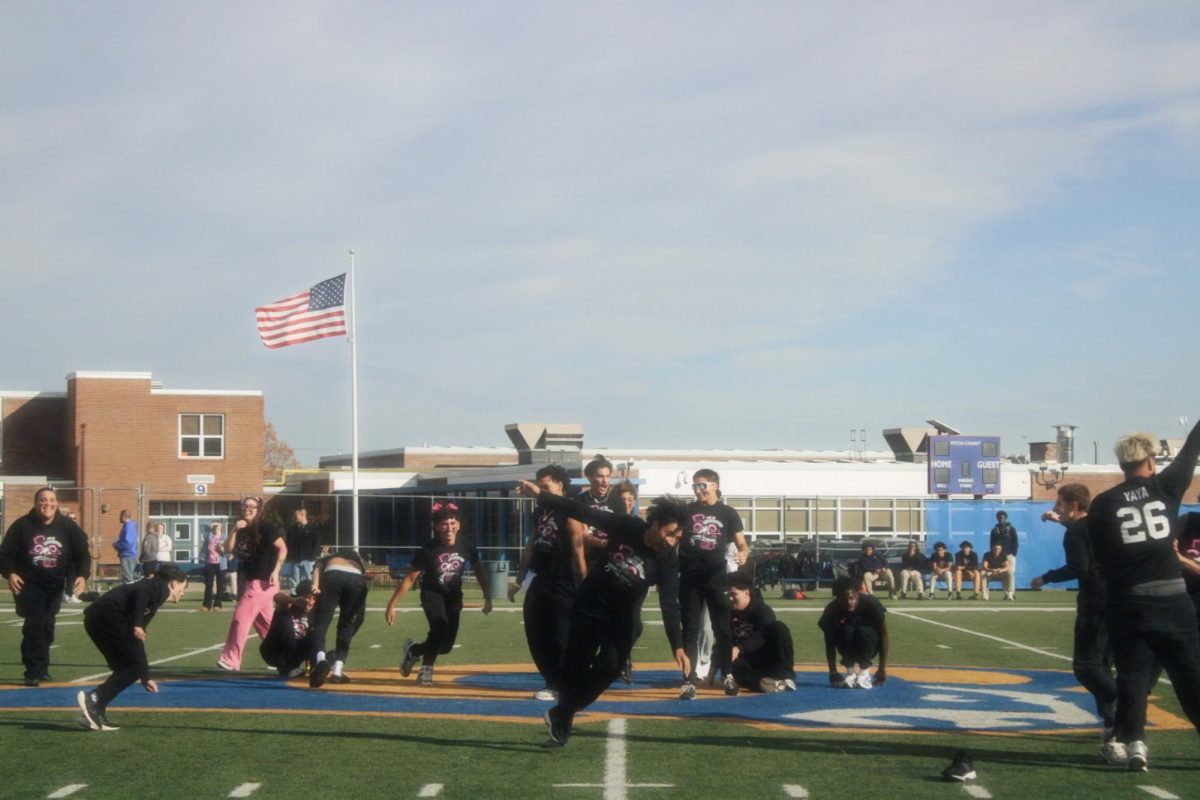 Senior boys perform their cheer routine 